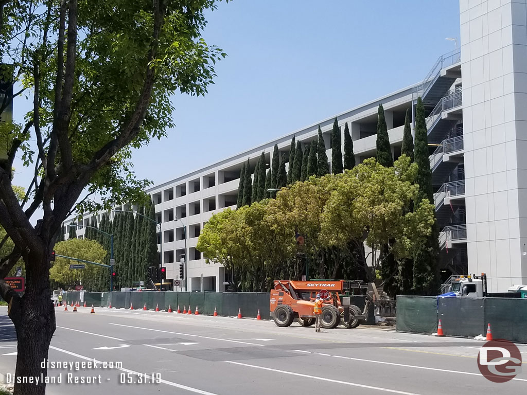 The trees appear to be all in now and work on the sidewalk, gate, and other landscaping is underway.