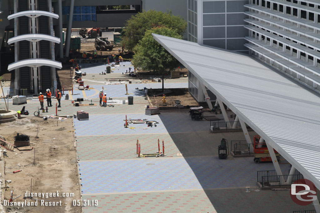 More pavers being installed in the distance.