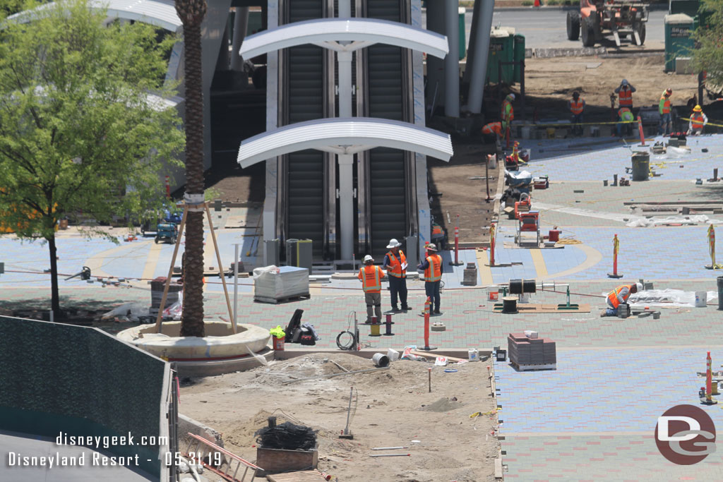 Pavers are installed around the escalators too.  And looks like seating around the tree.