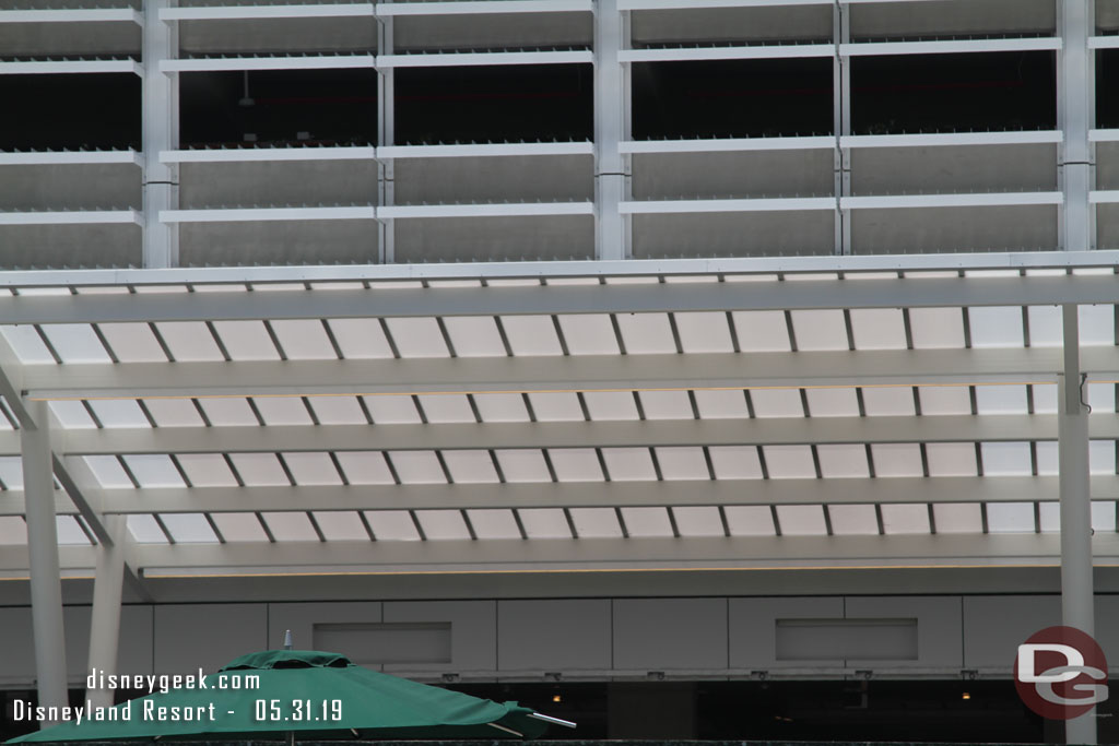 A closer look at the roof of the queue shade structure.  Assuming those cut out boxes will be indicators if the lane is open.