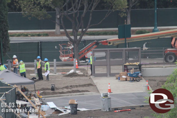 Another team is working on the perimeter fencing.  Notice the gates on the pedestrian walkway.  Also the tram way concrete is poured.