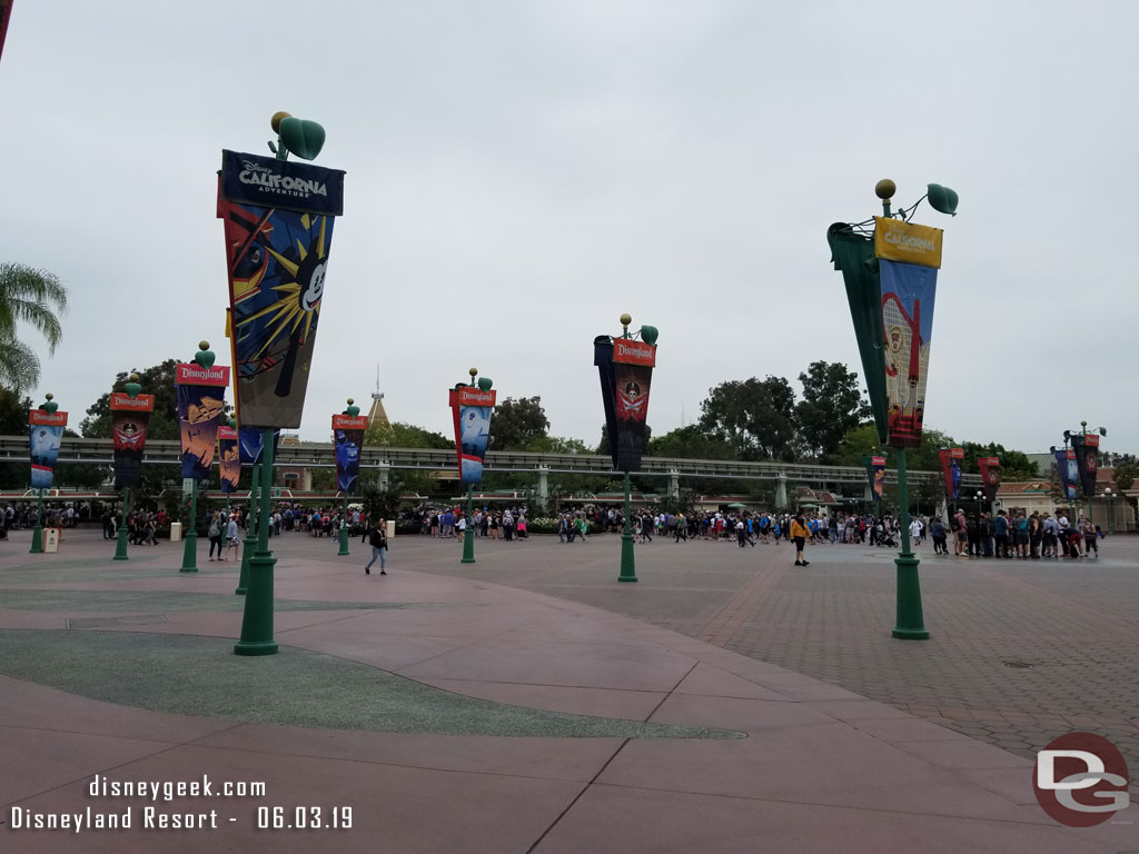 Disneyland queue extends past the Monorail.