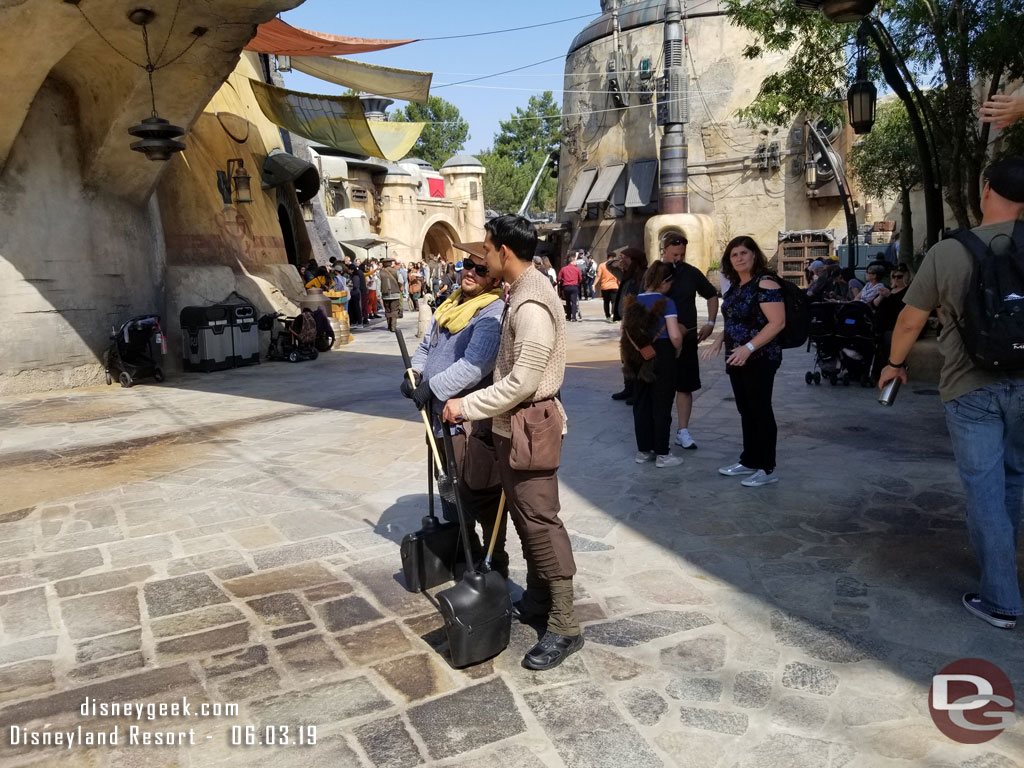 Custodial wears costumes to fit the land. No more uniform white like the rest of the park.