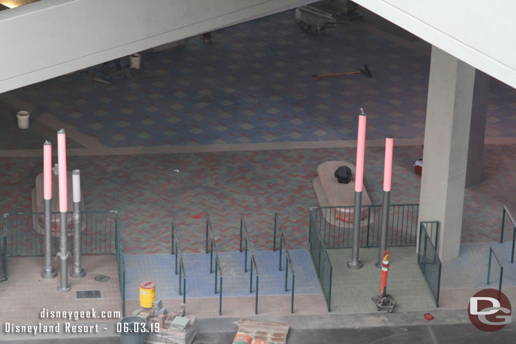 The protective plastic is removed and th ey were testing the lights at the tram stop.  Also looks like final paver installation along the concrete was going on.