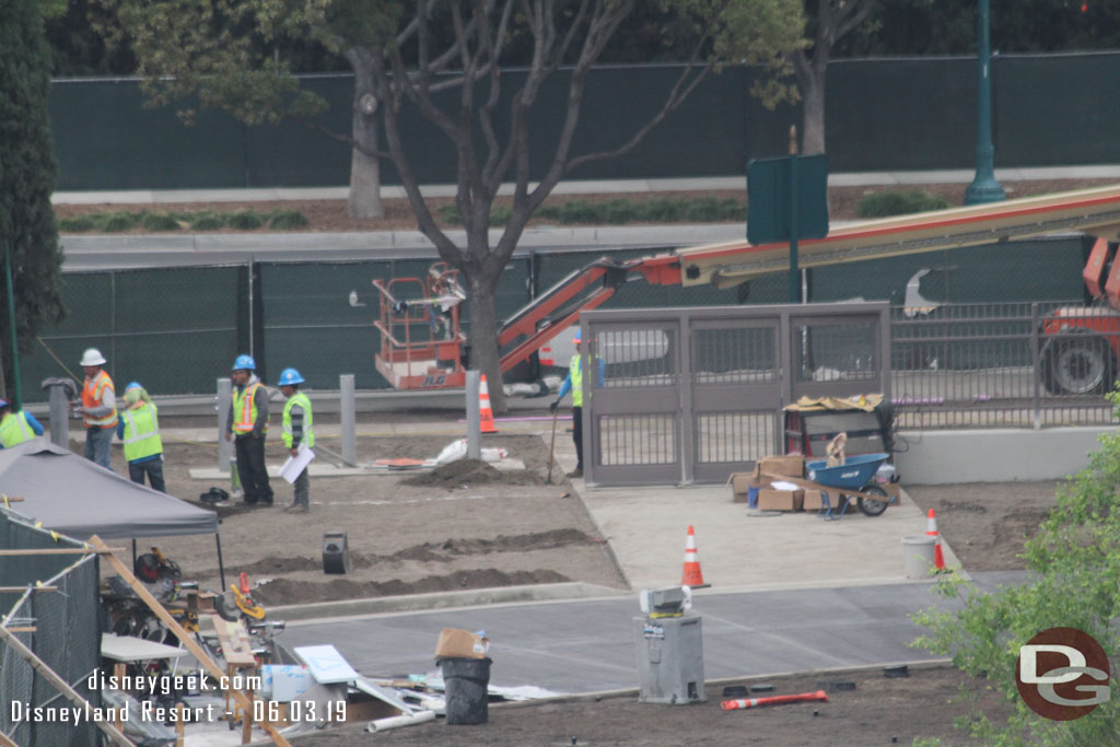 Another team is working on the perimeter fencing.  Notice the gates on the pedestrian walkway.  Also the tram way concrete is poured.