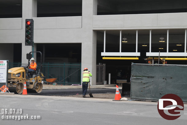 Blacktop being laid this afternoon for the parking structure driveway.