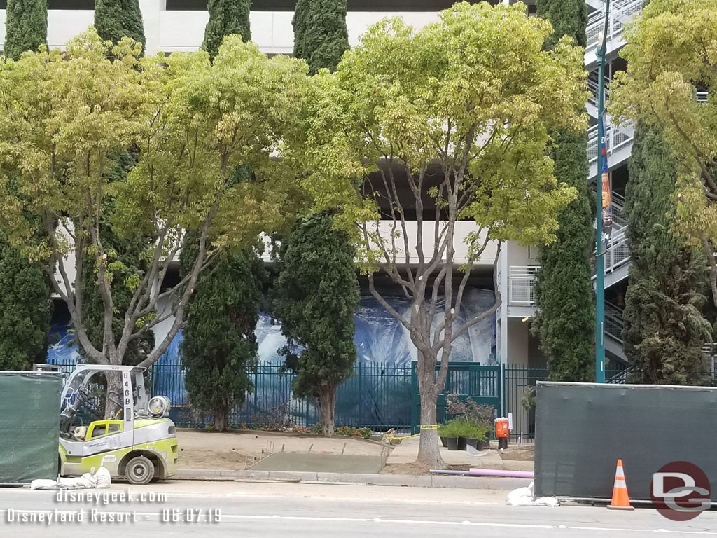 Looking across the street you can see the fence for the structure has been painted and more landscaping is going in.