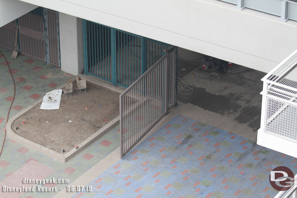 Gates are installed now and preparations for more fences around the planter on the left (notice the holes cut in the concrete).