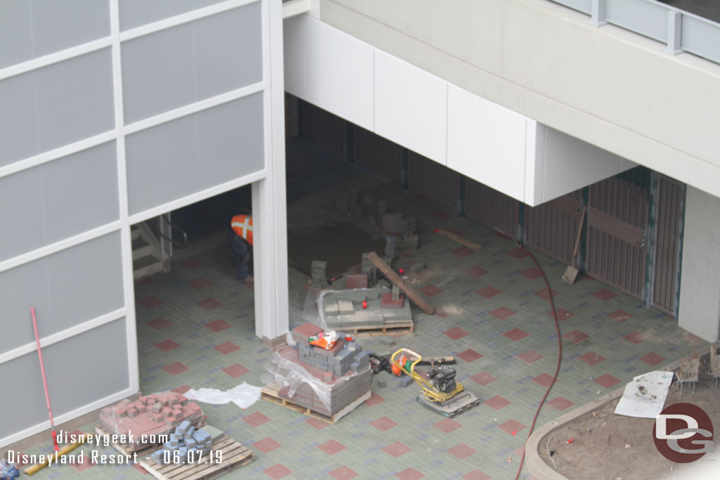 Finishing up the paver installation near the stairs.