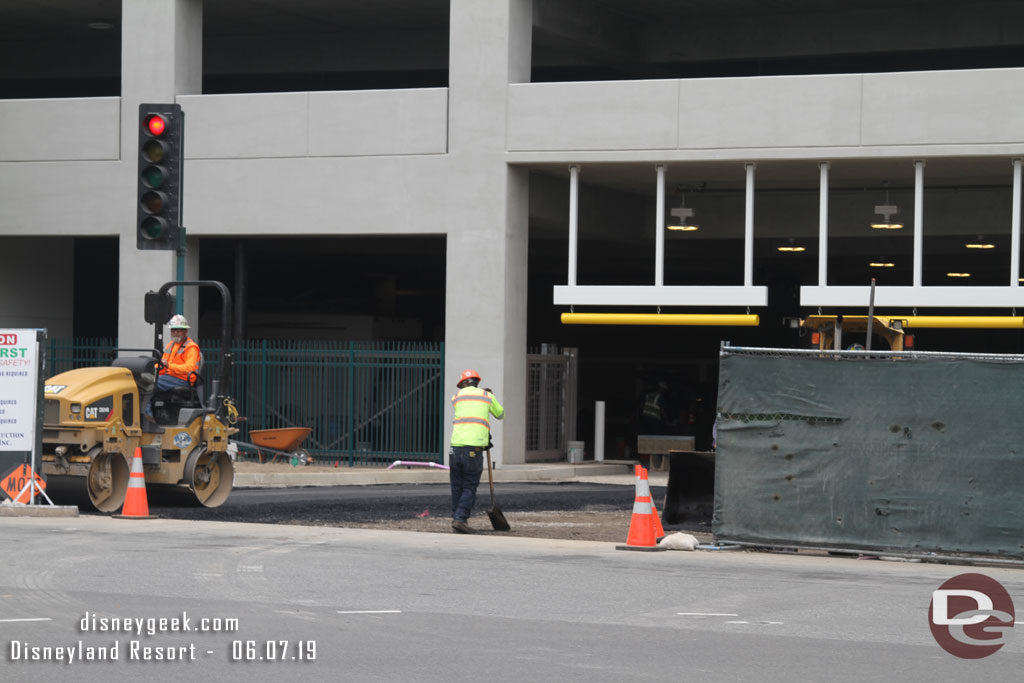 Blacktop being laid this afternoon for the parking structure driveway.