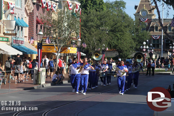 The 2019 Disneyland Resort All-American College Band making its way up Main Street USA