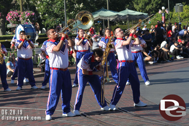 The band is one trombone player short today. He was in a wheelchair for the Flag Retreat, but for the marching sets he was unable to participate.