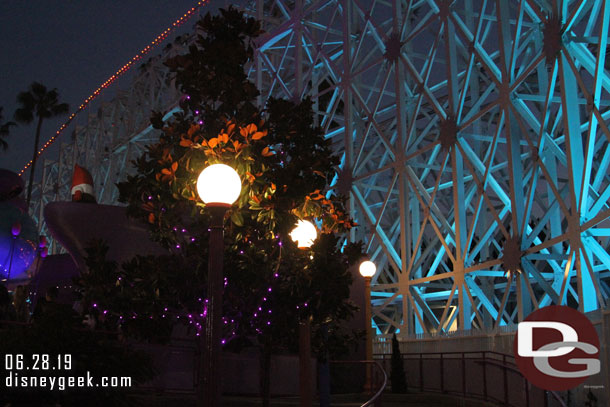 Some lights on the trees by the exit ramp.