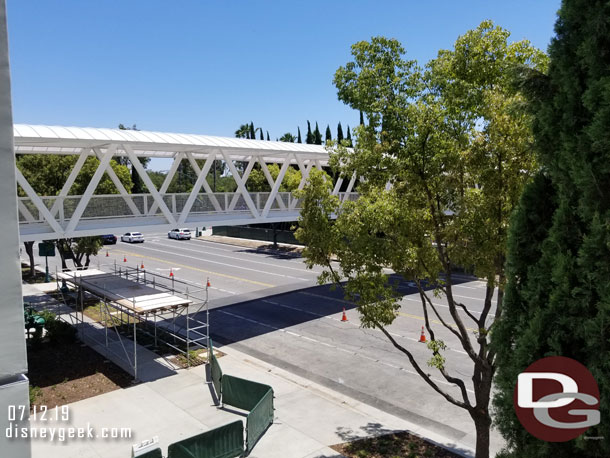 The temporary barriers on the sidewalk are to guide those walking to Downtown Disney & the parks to the intersection with Disneyland Drive to cross the street.