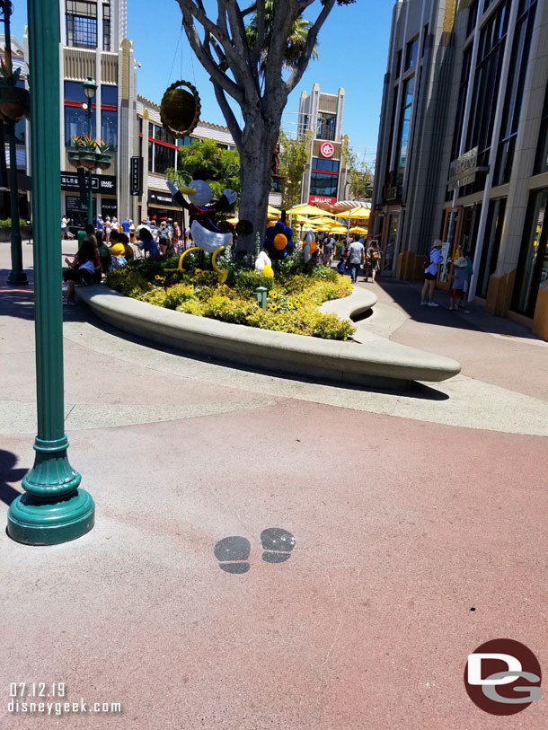 The optimal spot for each is marked on the ground with Mickey footprints.  