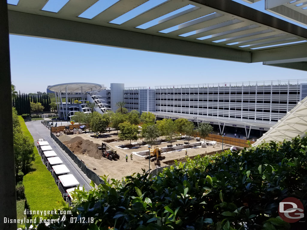 Trees are being installed in the parking structure tram plaza.  