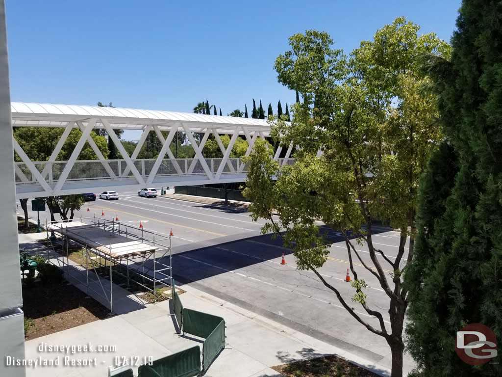 The temporary barriers on the sidewalk are to guide those walking to Downtown Disney & the parks to the intersection with Disneyland Drive to cross the street.