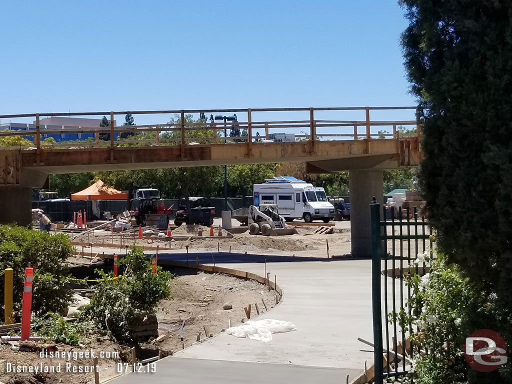 A closer look at the ground level path crossing under the ramp from the bridge.