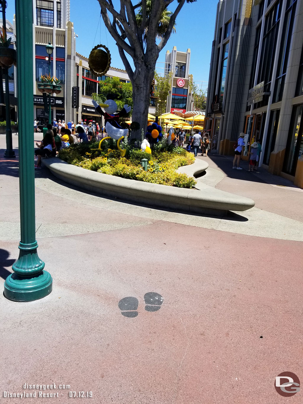 The optimal spot for each is marked on the ground with Mickey footprints.  