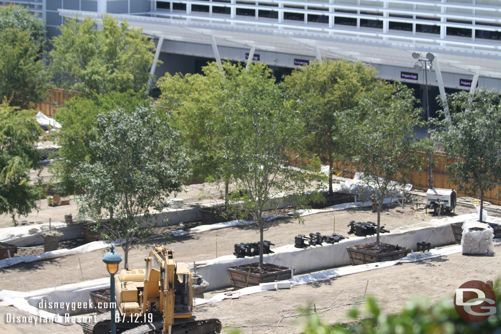 They have dug large trenches and placed the trees into them.