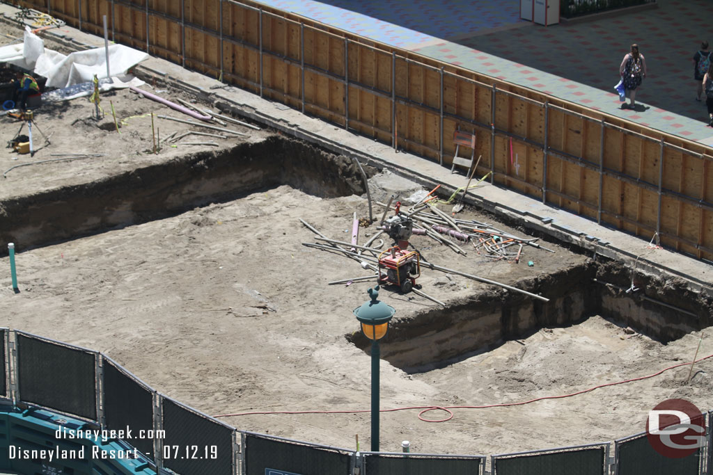 Smaller pits dug closer to the escalators.