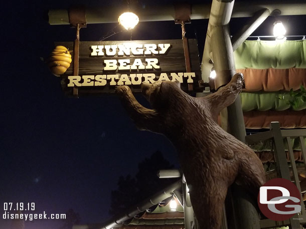 The Hungry Bear sign at night.