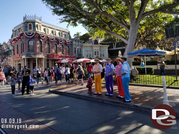 The Dapper Dans of Disneyland performing along Main Street USA