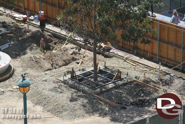 Concrete around the trees.