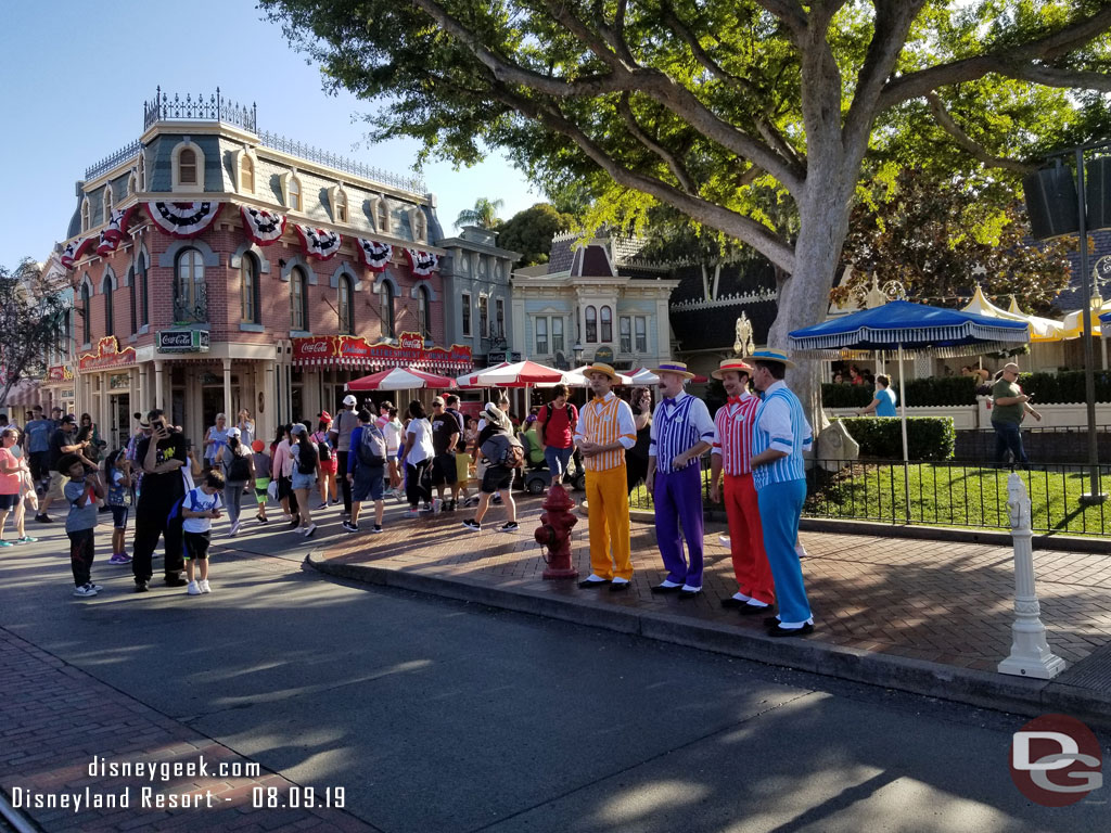 The Dapper Dans of Disneyland performing along Main Street USA