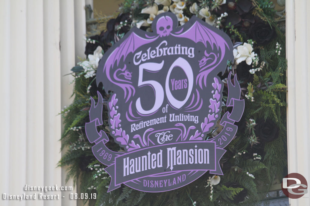 A closer look at the 50th sign on the mansion.