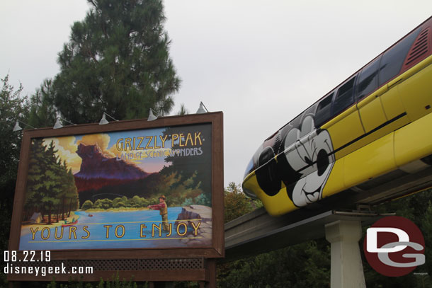 A monorail passing overhead.  Still featuring the Get Your Ears on wrap.