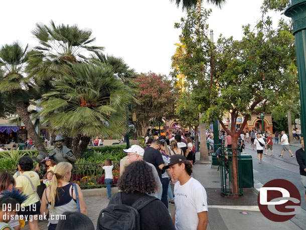 The line for popcorn buckets stretched past the Storytellers statue this evening.