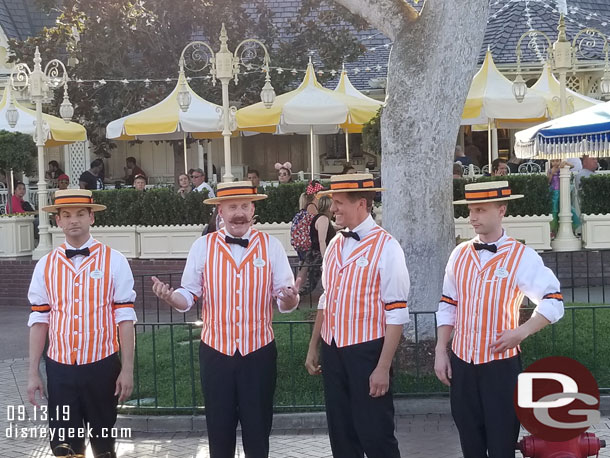 The Dapper Dans of Disneyland performing along Main Street USA.