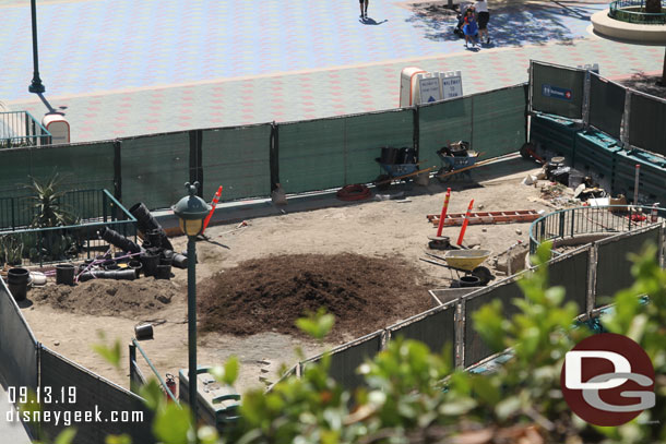 The one area that is left.  Looks like a ring on the left for a statue for this side of the plaza to match the Pixar Ball on the other side perhaps.