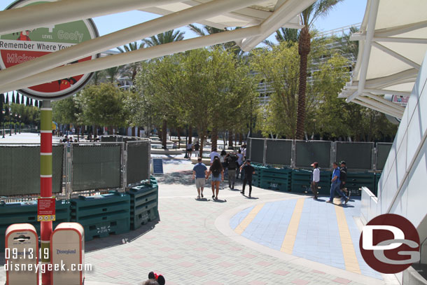 The view from the escalators of the current walkway through the two fences.