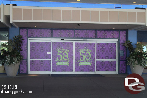 The Disneyland Hotel Fantasy Tower Lobby is celebrating the 50th Anniversary of the Haunted Mansion.  These are the main entrance sliding doors.