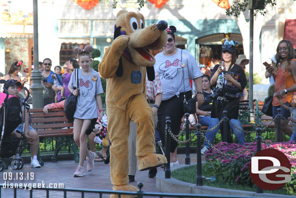 Pluto marching around Town Square.