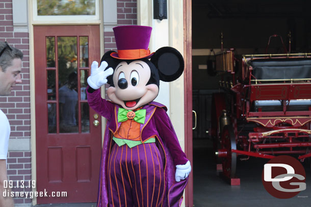 Mickey greeting guests near the Firehouse in Town Square.