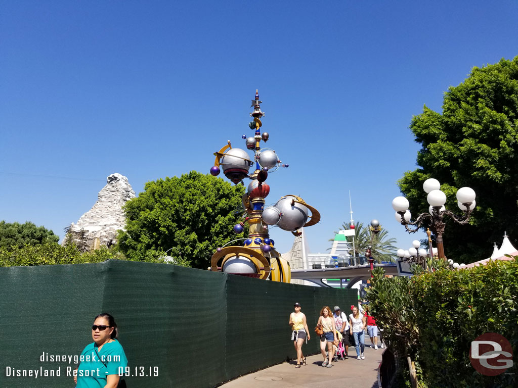 More walls as you head toward Tomorrowland.  The south side of the entrance is now behind walls for the removal of the rocks and other pavement work.