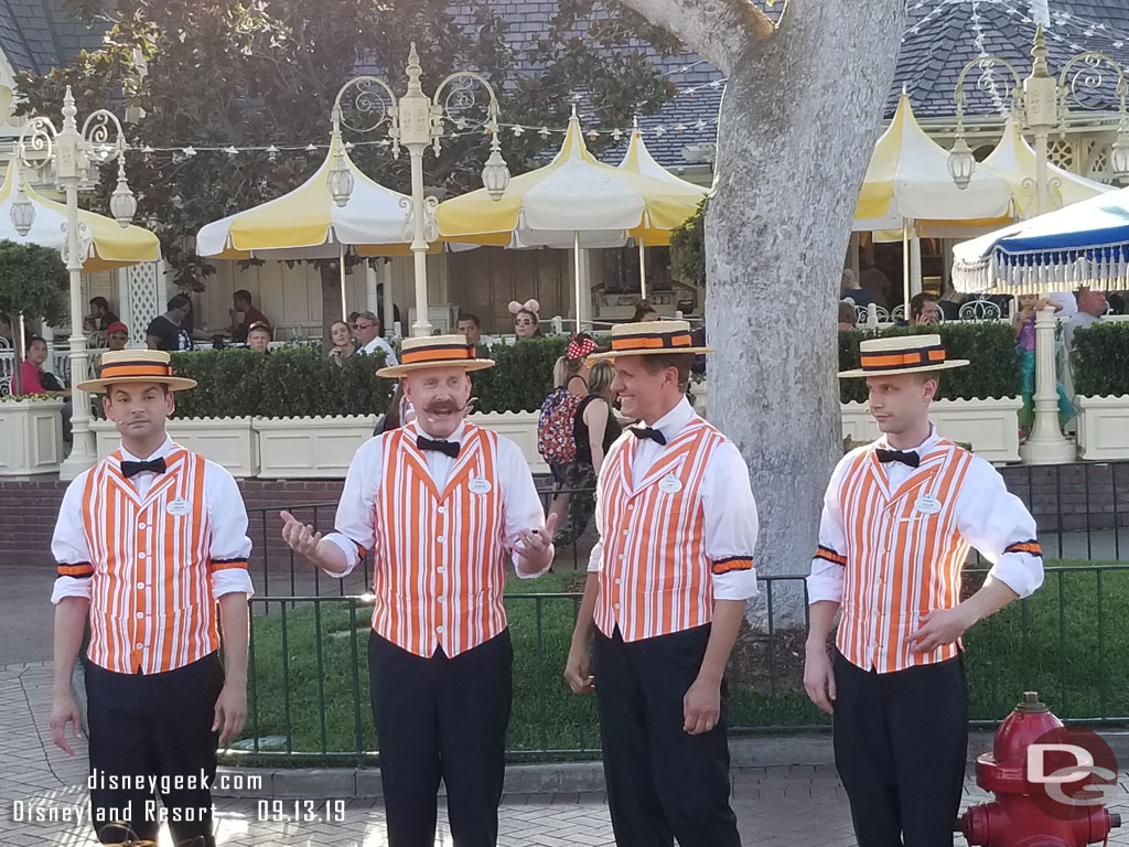 The Dapper Dans of Disneyland performing along Main Street USA.