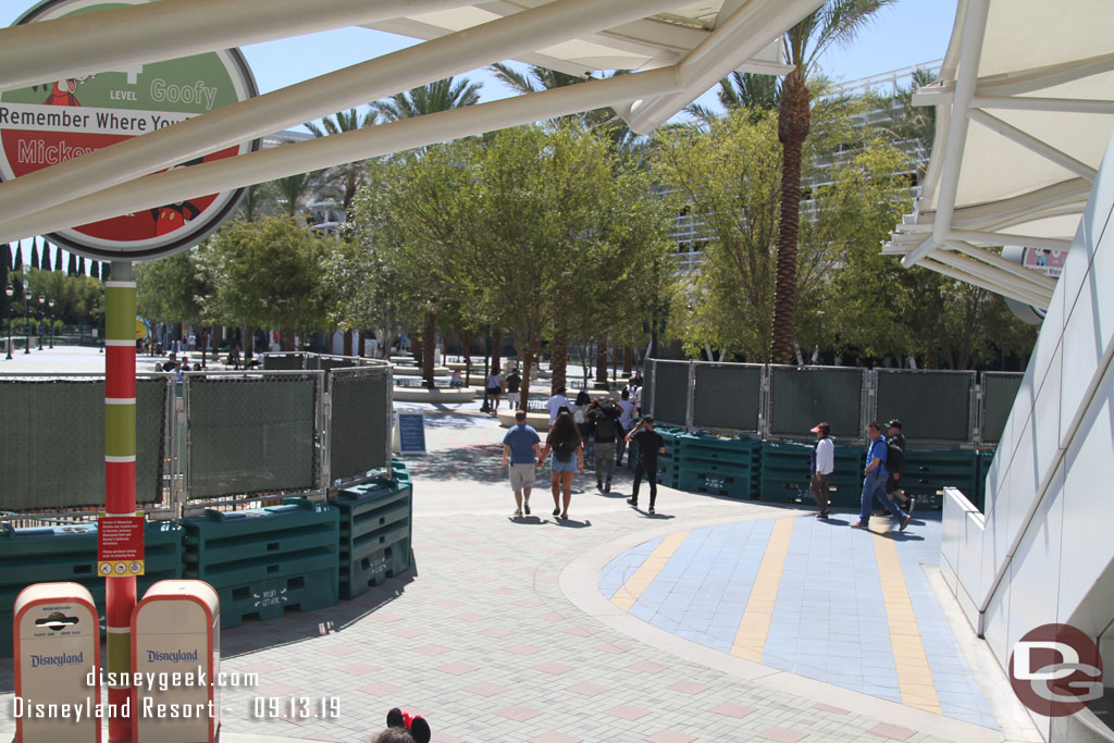 The view from the escalators of the current walkway through the two fences.