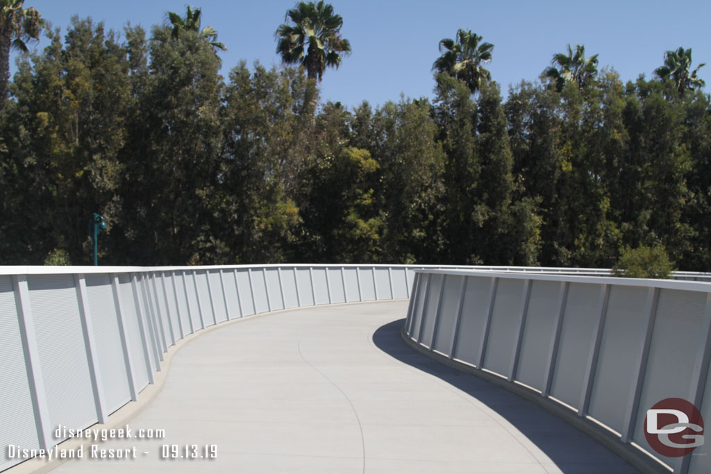 The ramp from the bridge down to the walkway.