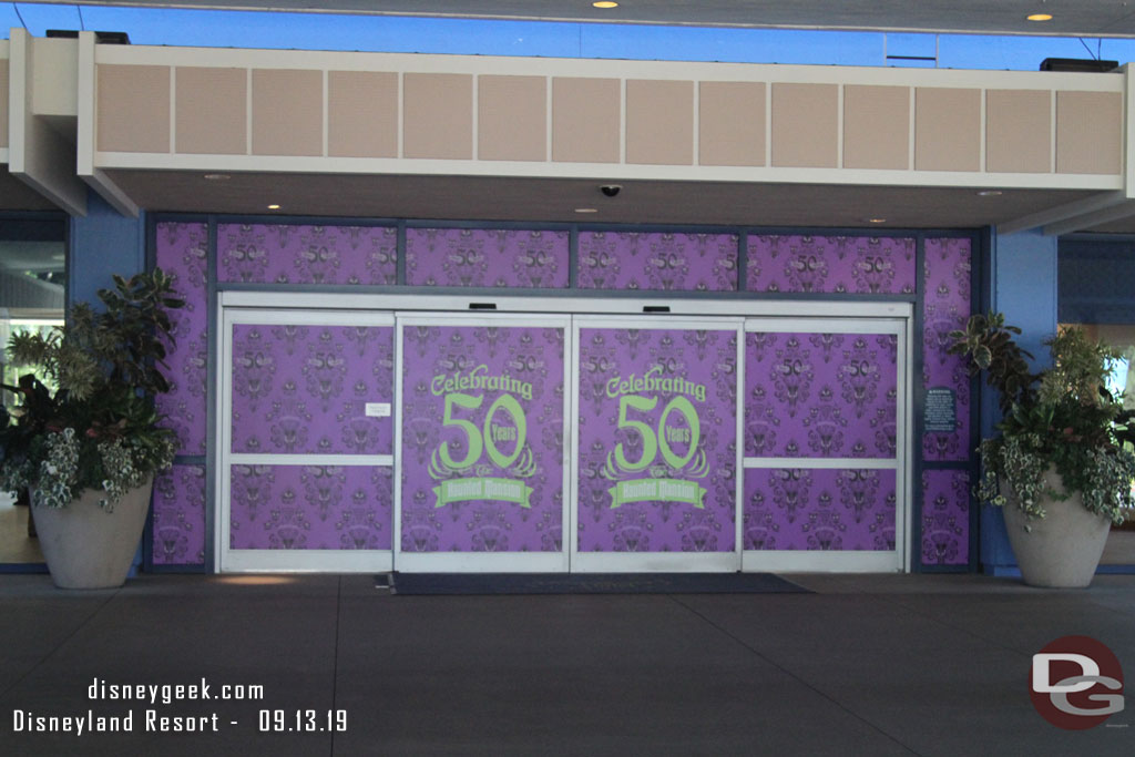 The Disneyland Hotel Fantasy Tower Lobby is celebrating the 50th Anniversary of the Haunted Mansion.  These are the main entrance sliding doors.