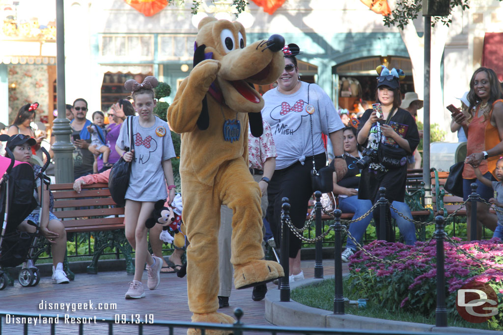 Pluto marching around Town Square.