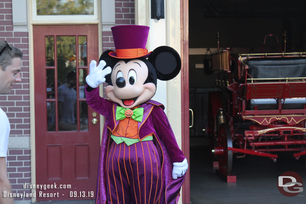 Mickey greeting guests near the Firehouse in Town Square.