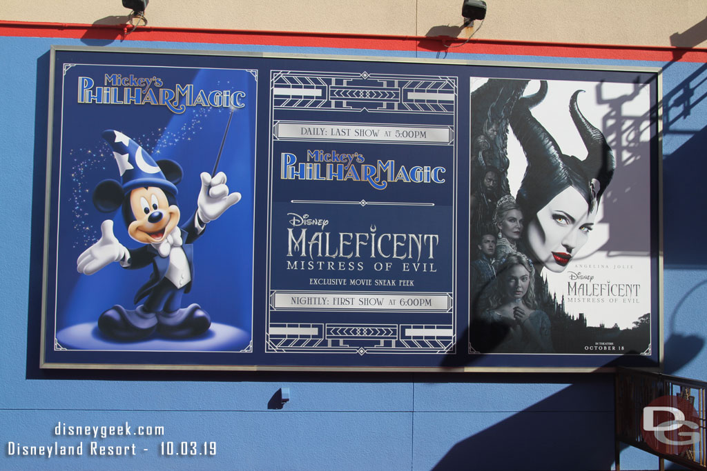 The theater schedule on the large poster before entering the building.