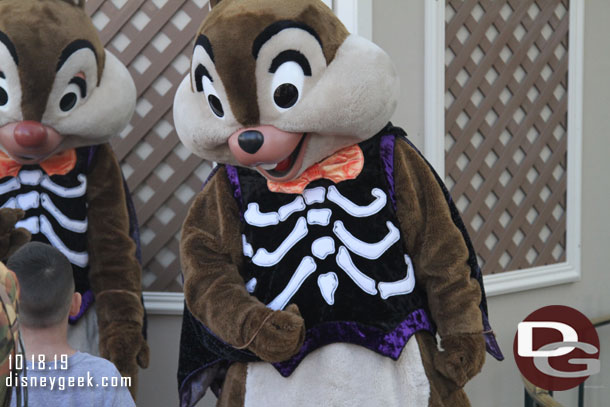 Chip and Dale meeting guests nearby.