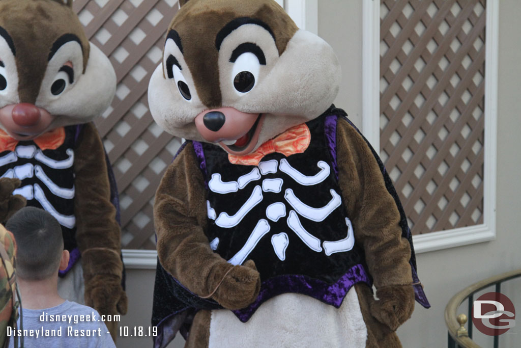 Chip and Dale meeting guests nearby.