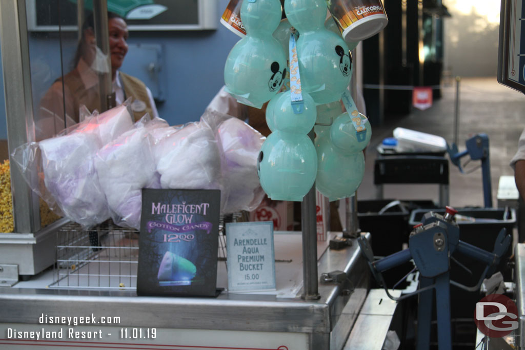 Maleficent Glow Cotton Candy and Arendelle Aqua popcorn buckets for sale at the Hyperion.