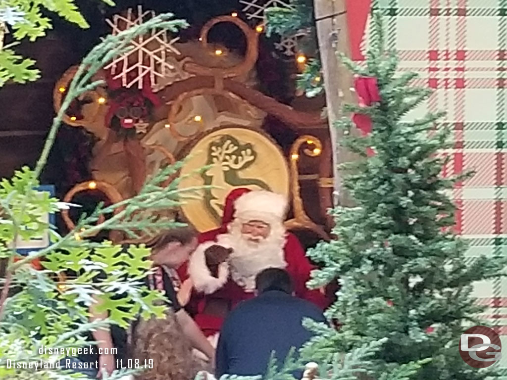 The way Santa is positioned if you do not wait in line you have a very limited field of view through the trees and other obstructions to get a glimpse of him.